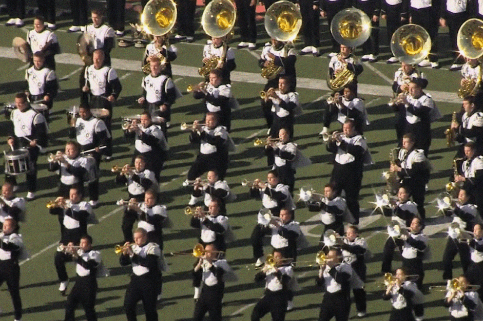 football field with band playing